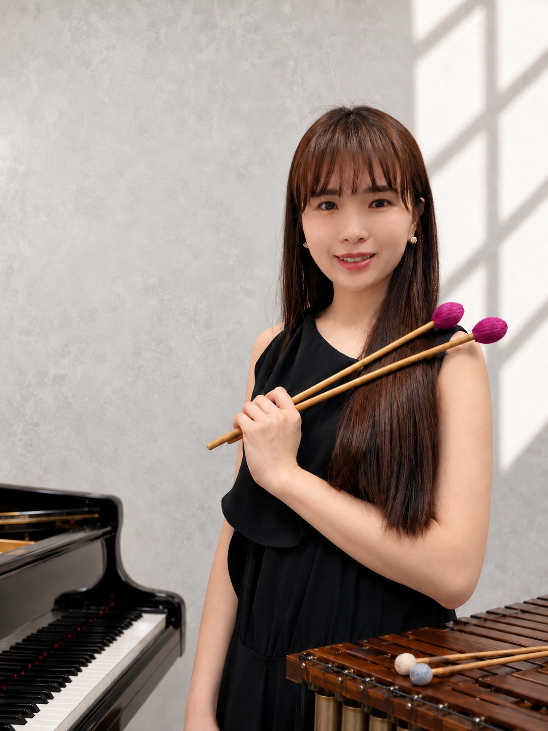 李育萱,主修鋼琴、打擊